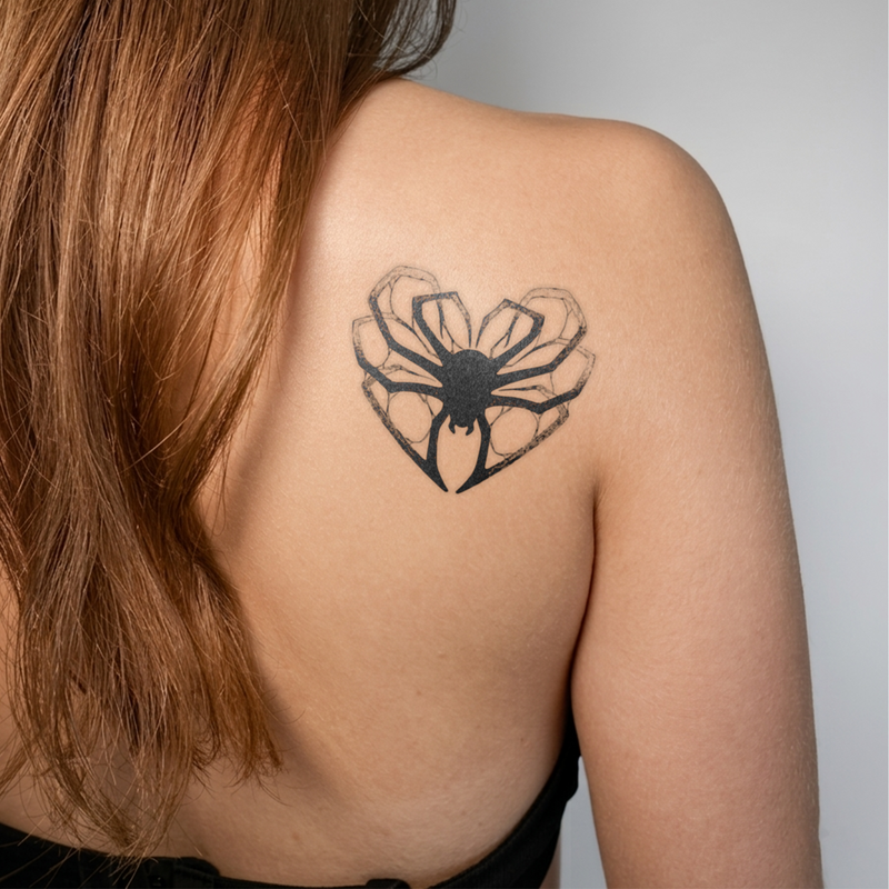 Arachnid Love Tattoo on the girl's back 