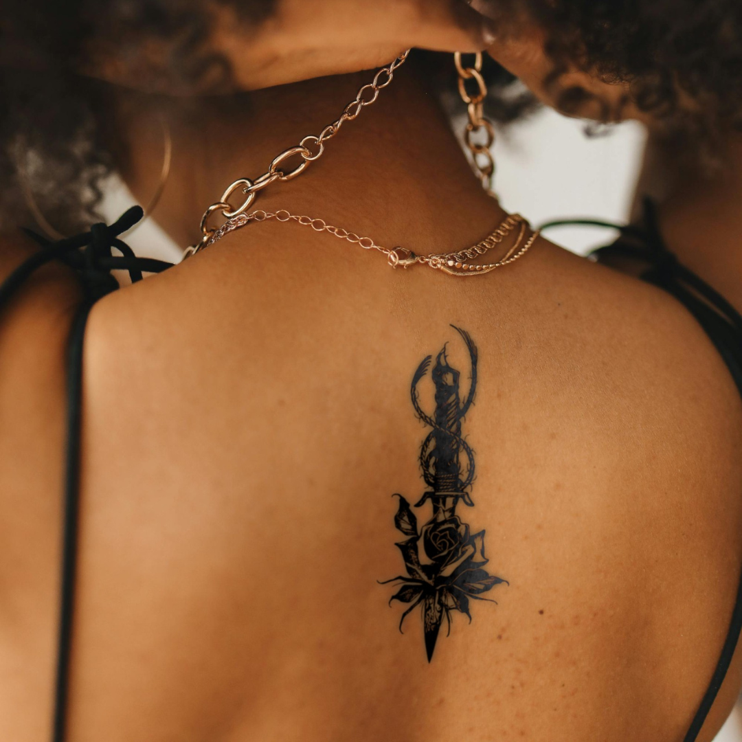 Blade and Bloom Tattoo on back