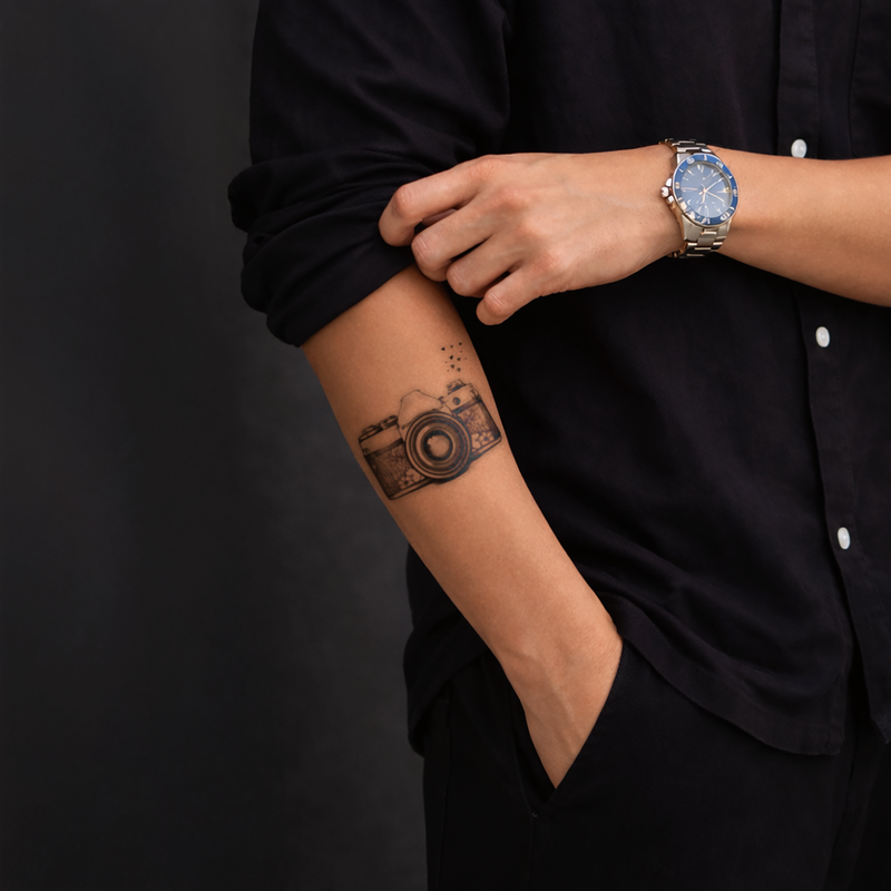 Person wearing a watch with a black background