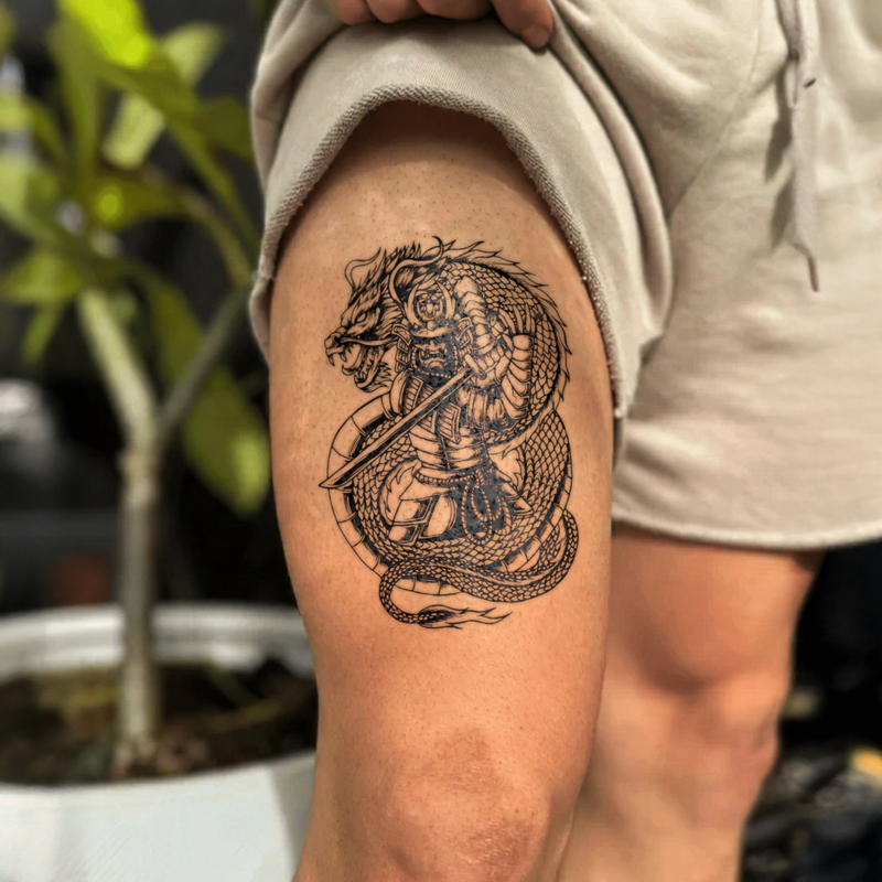 Tattoo of a warrior on a snake on a person's arm with a blurred background