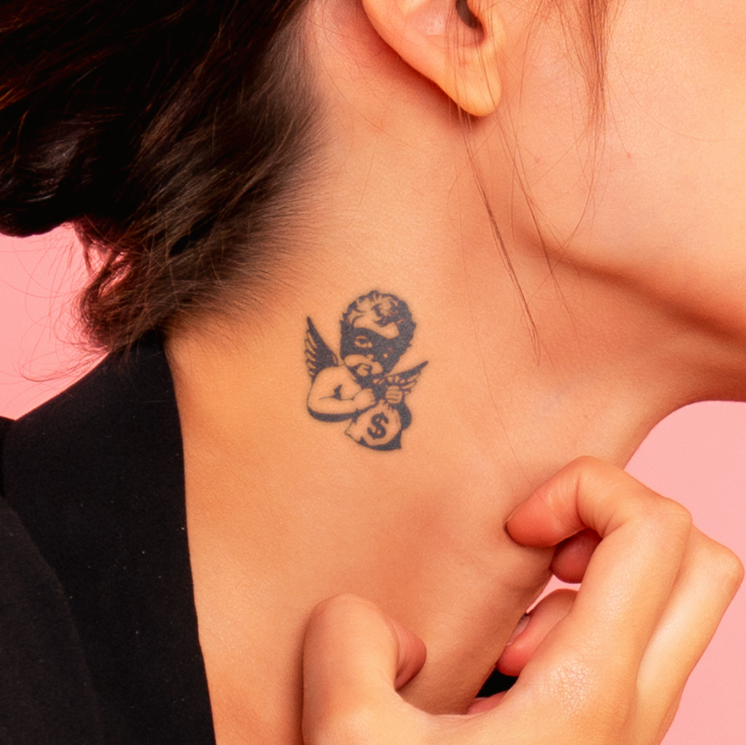 Person with a small tattoo on their neck against a pink background