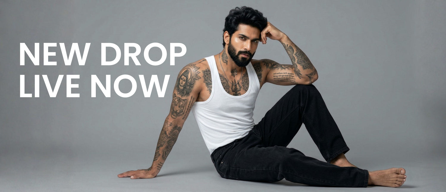 Man sitting on a gray background with text 'NEW DROP LIVE NOW'