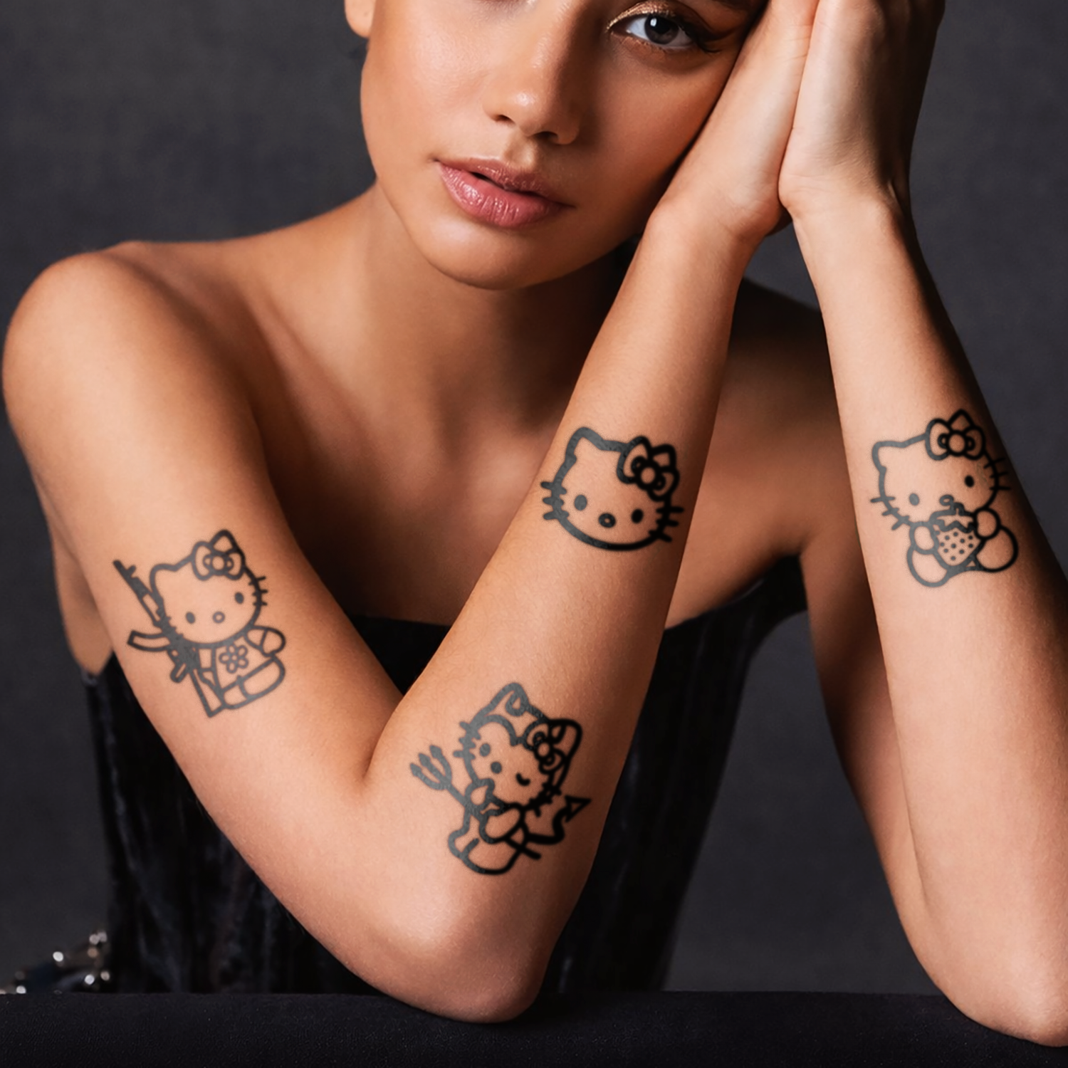 Woman with Hello Kitty tattoos on her arms against a dark background