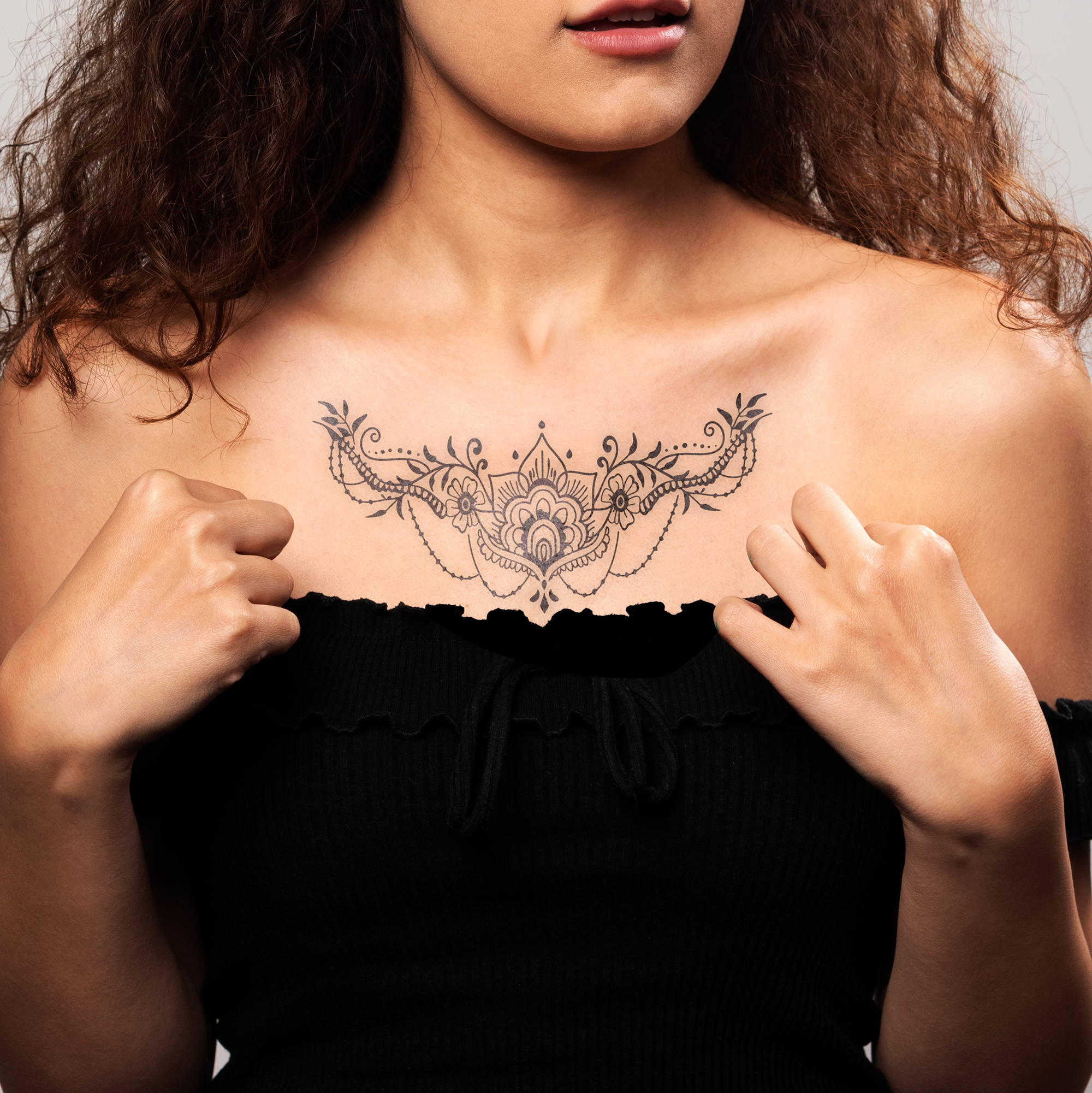 Sacred Bloom Chest Tattoo