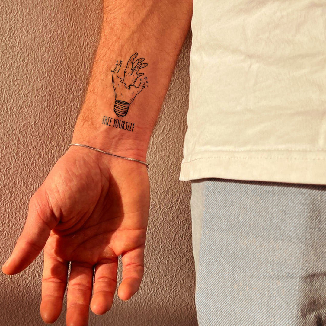 Free Yourself Tattoo on wrist