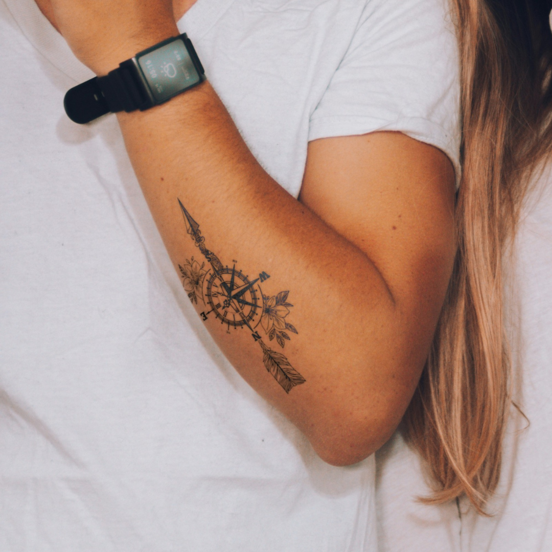 Compass tattoo on arm 