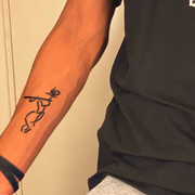 Krishna Flute Tattoo on arm