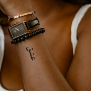 Love Ishq Urdu Tattoo on hand