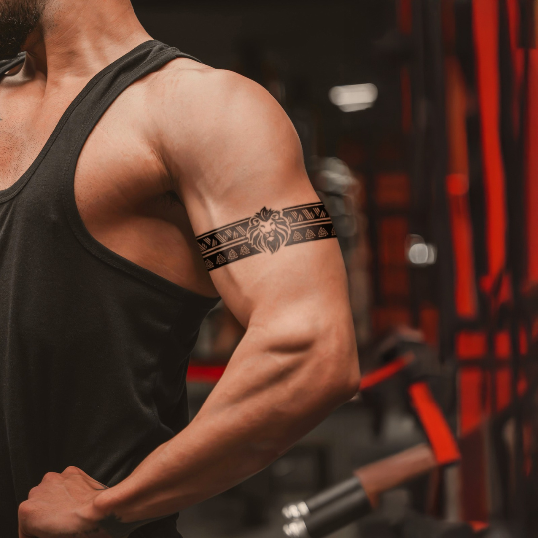Lion's Legacy Armband Tattoo on bicep 
