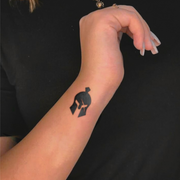 Warrior Mask tattoo on arm