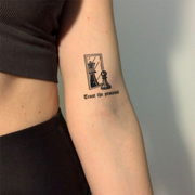 Trust The Process Tattoo on arm