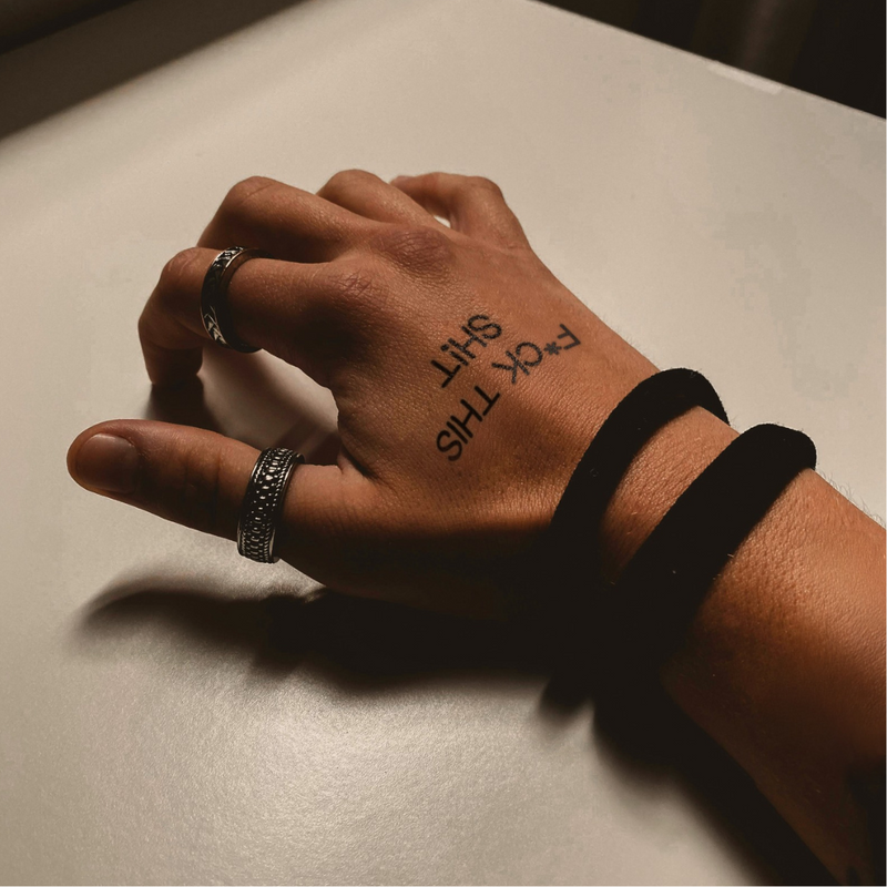 F*uck this shit tattoo on hand