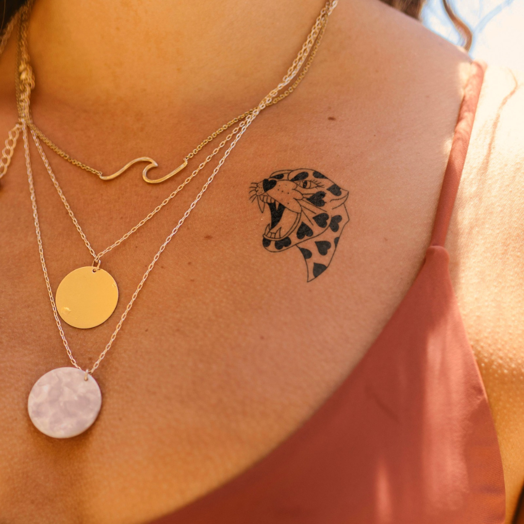 Heart Spotted Fury Tattoo on chest