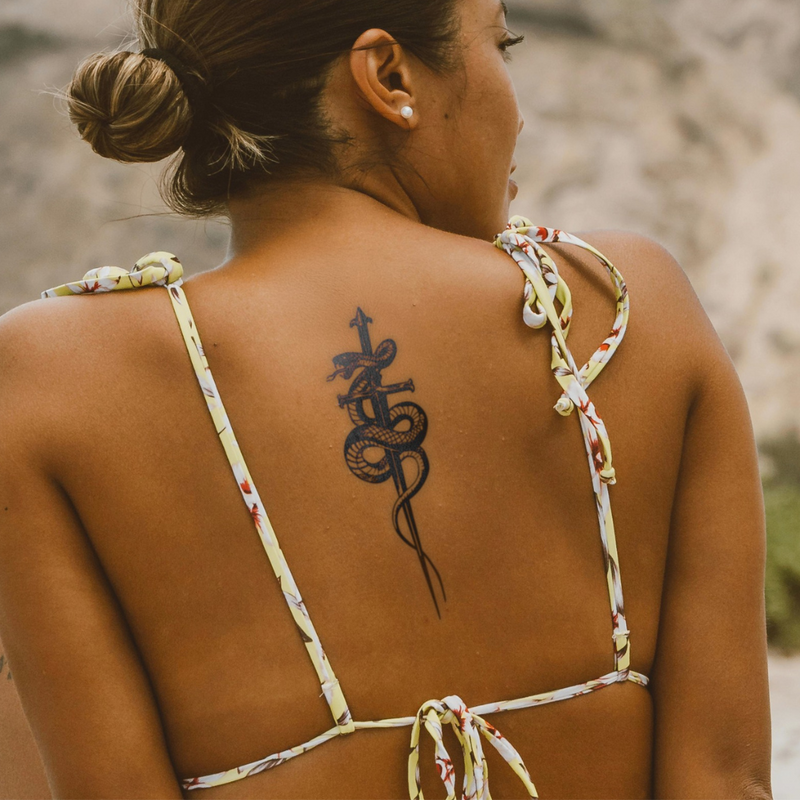 Cunning Steel Tattoo on back