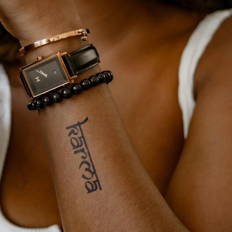 Karma Tattoo on arm