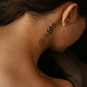 Breathing Om Tattoo on neck