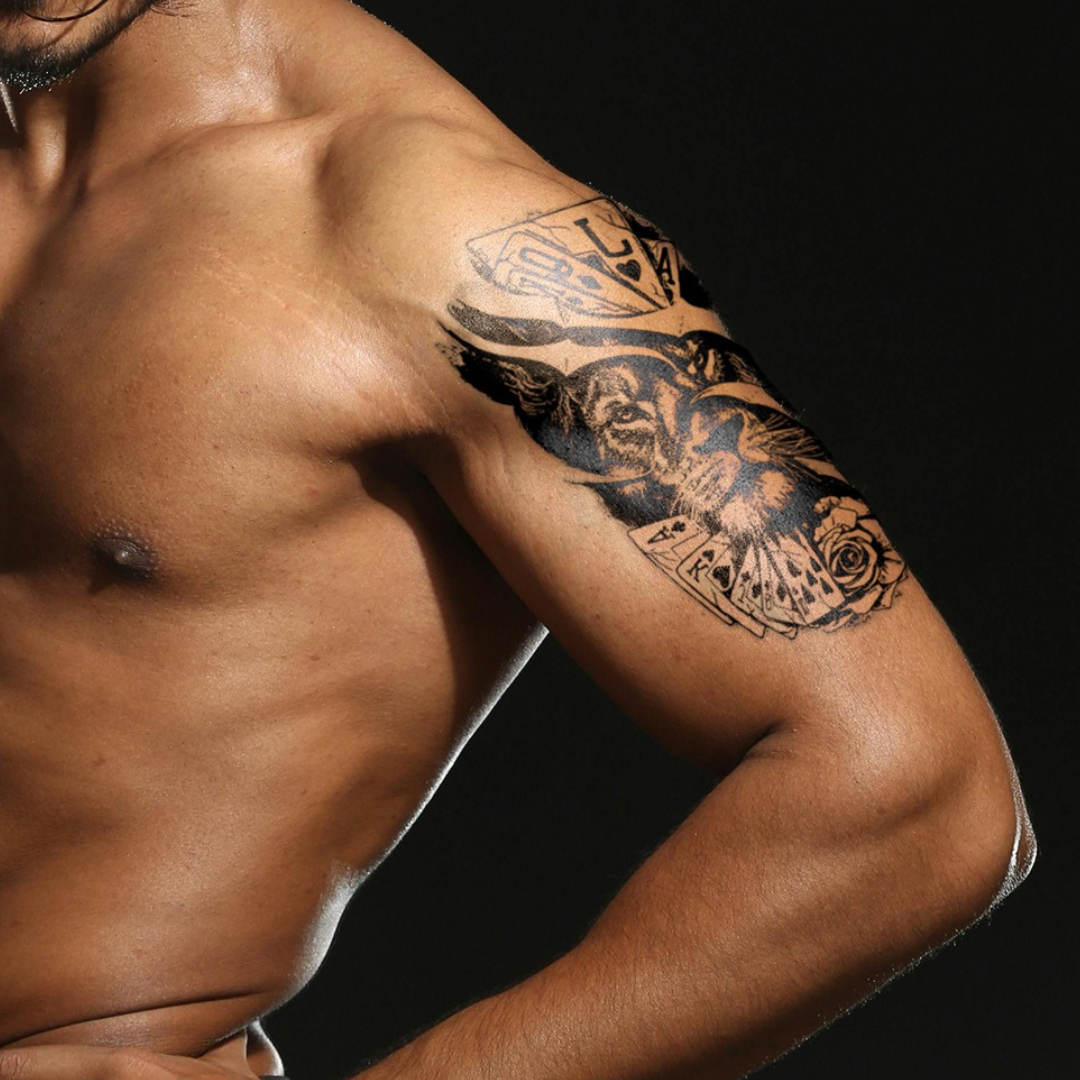 Pride of aces tattoo on arm