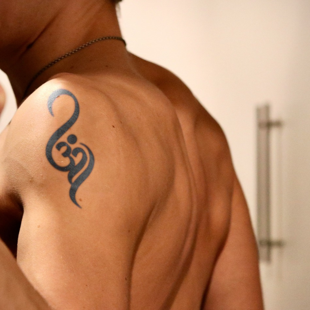 Om tattoo on shoulder