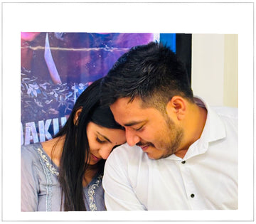 Two people embracing with a colorful background