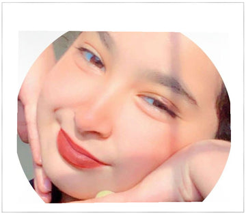 Close-up of a person's face with a neutral expression