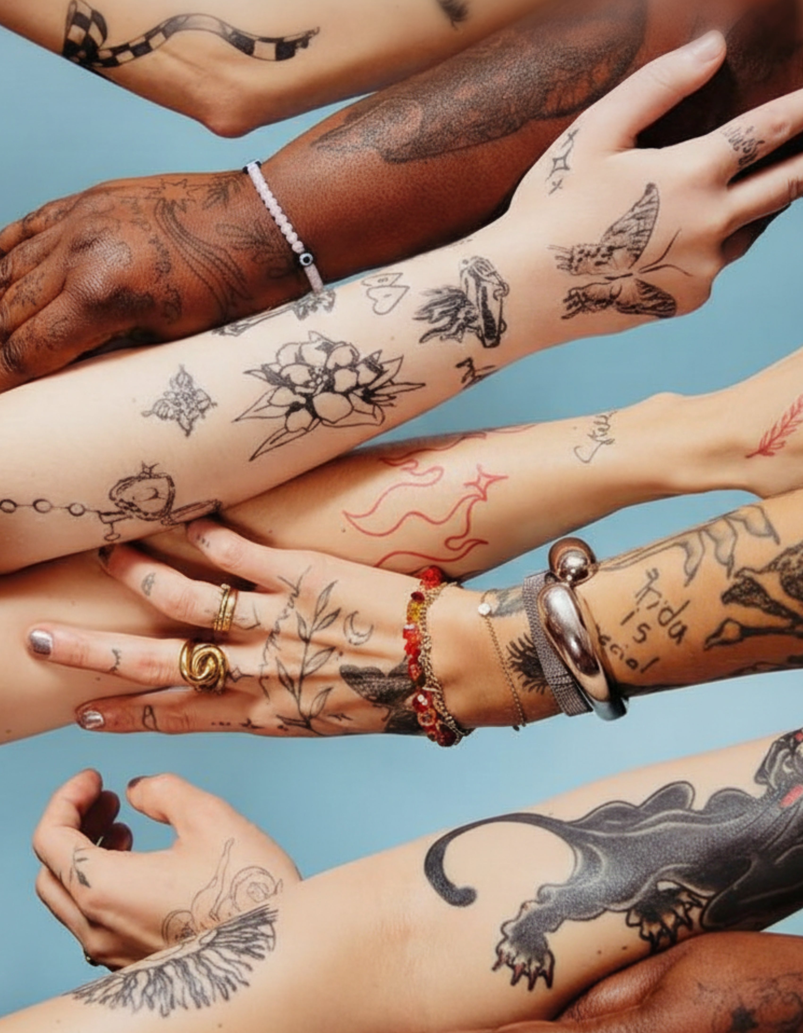 Collage of multiple arms with tattoos and jewelry on a blue background